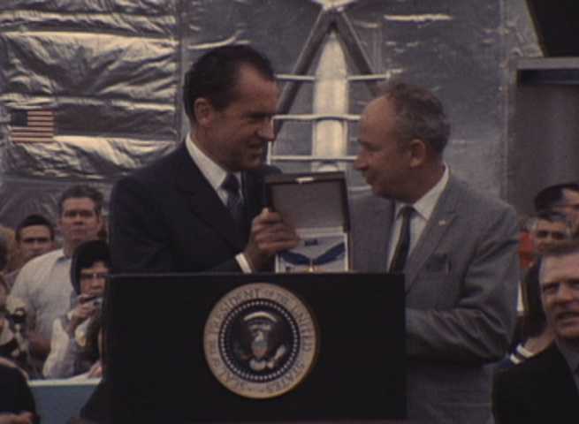 18 April 1970) --- President Richard M. Nixon and astronaut James A. Lovell  Jr., Apollo 13 commander, shake hands at special ceremonies at Hickam Air  Force Base, Hawaii. - SuperStock